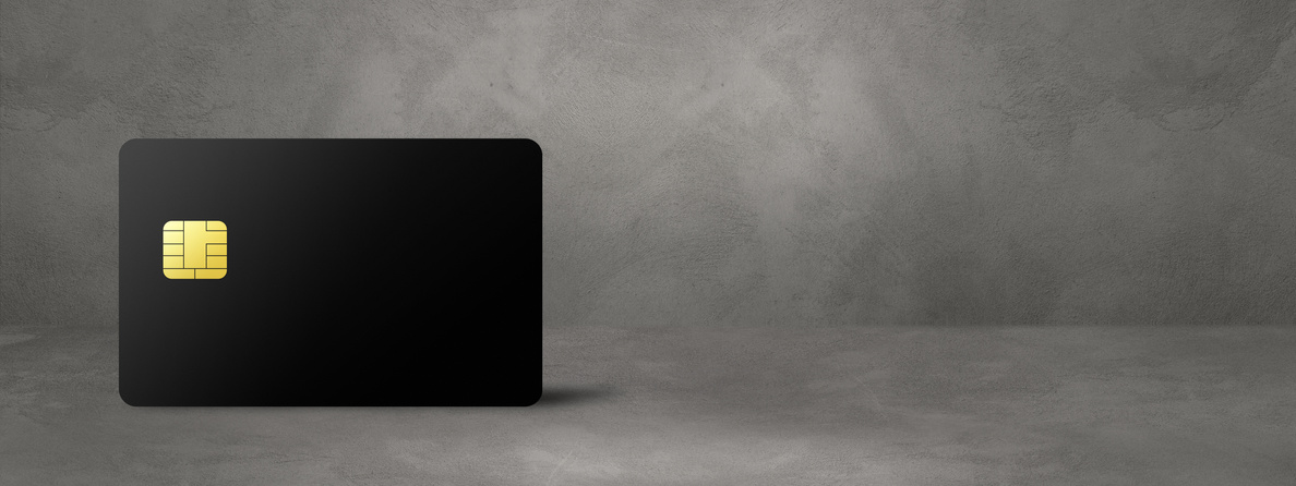 Black Credit Card on a Concrete Background